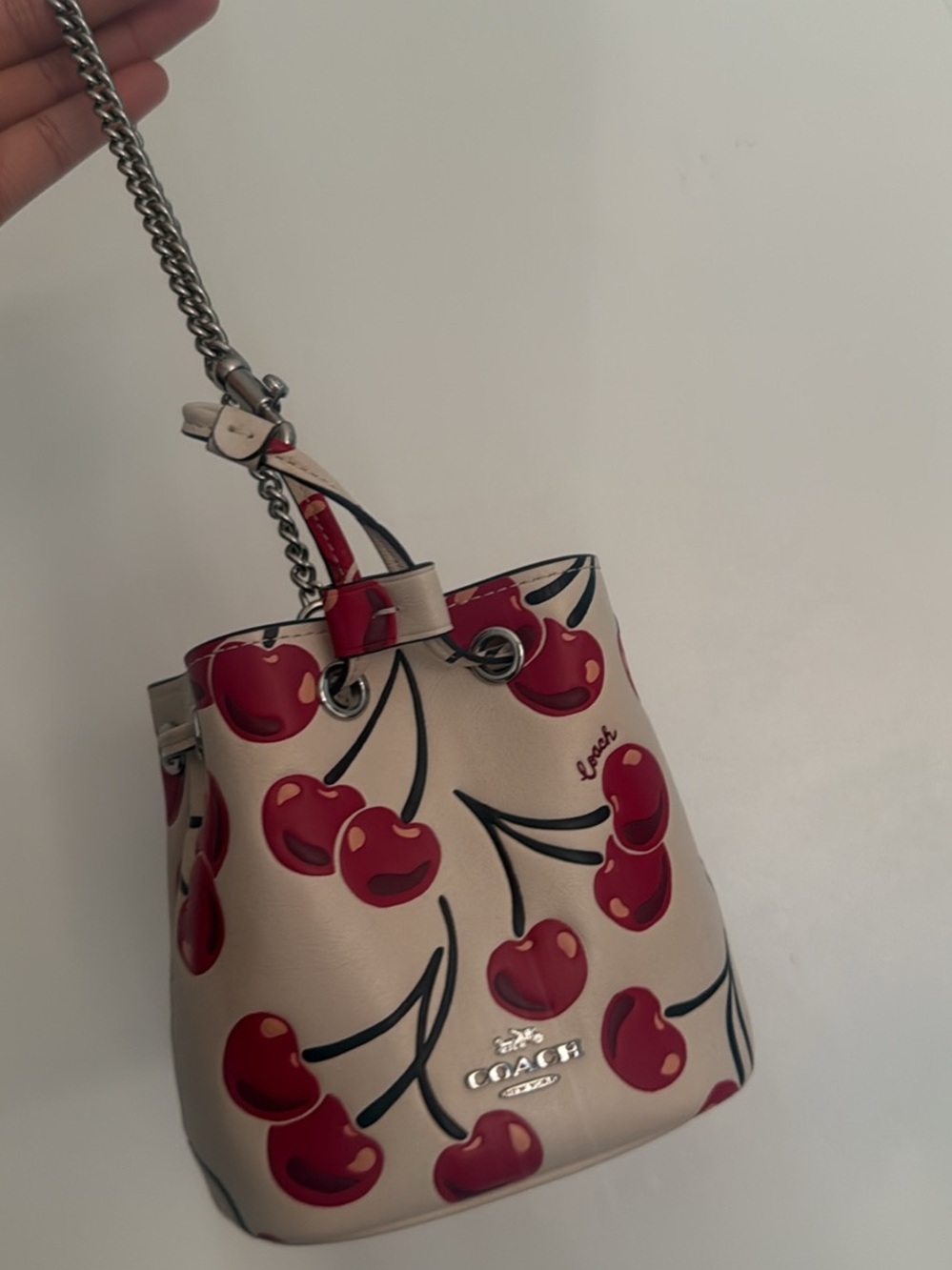 Coach Beige Mini Bucket Bag with Red Cherry Motif
